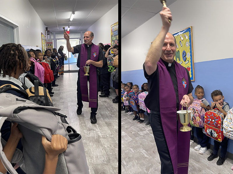 Priest blessing backpacks for students