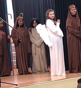 Students on stage in a Christmas play